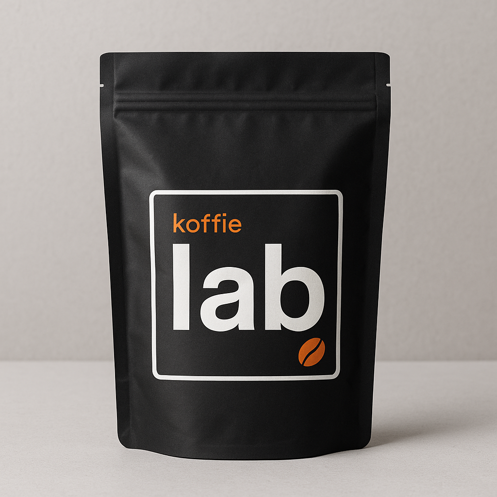 Black coffee packaging with 'koffie lab' branding on a neutral background